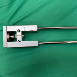 Close-up of cylinder head showing label and rod assembly