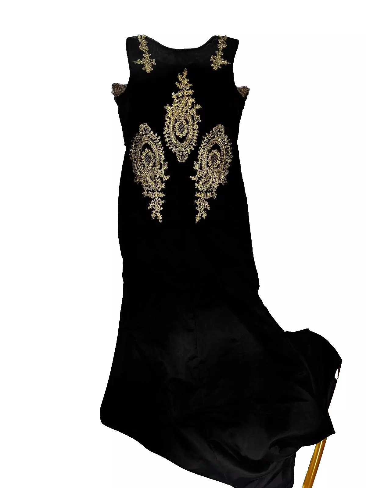 Back view of gown showing symmetrical gold embroidery on black fabric