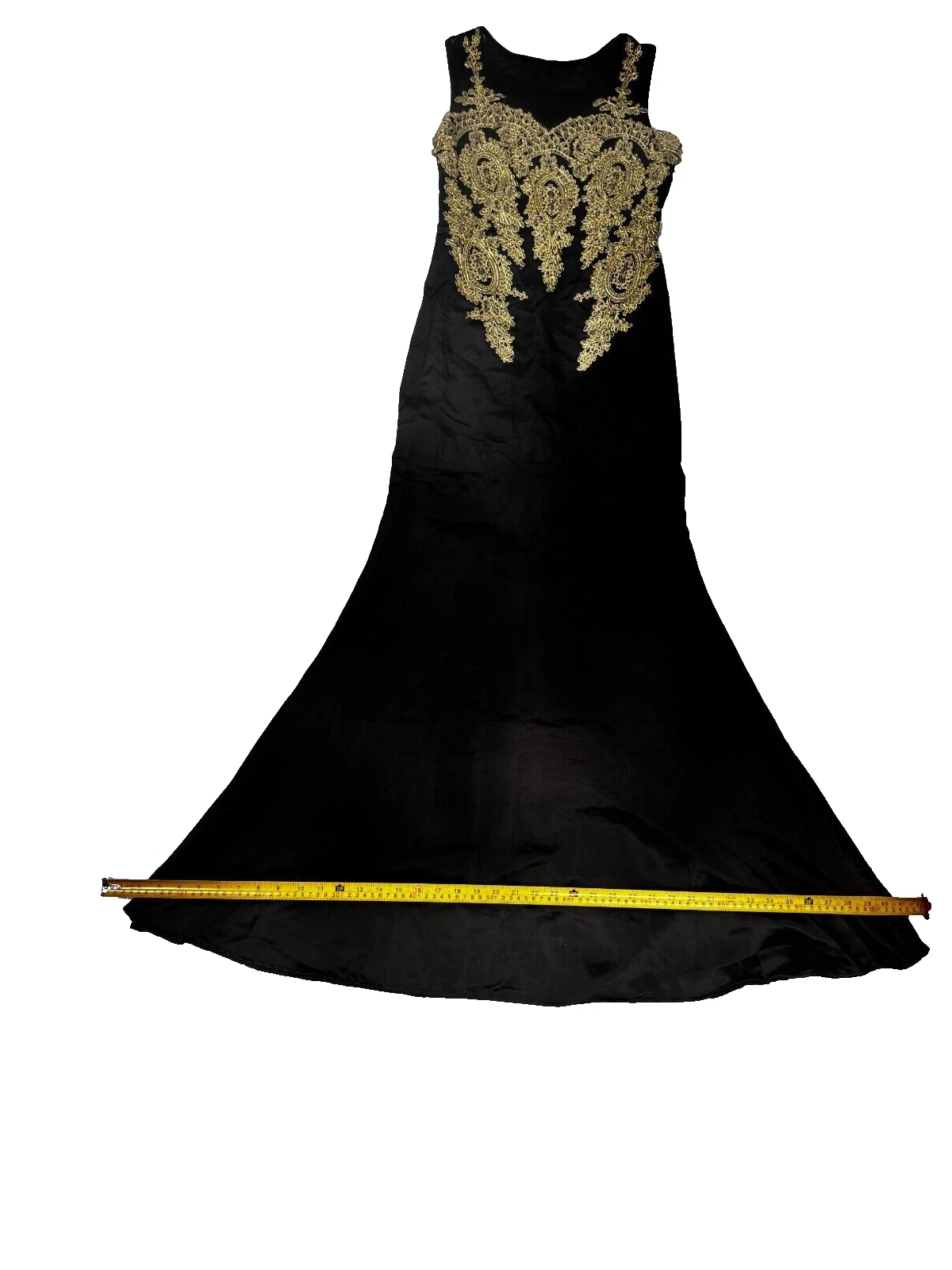 Full front view of the gown with measuring tape across the flared hem