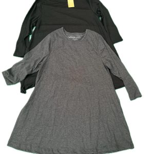 Two long sleeve t-shirts from Capsule laid flat, one in black and one in grey