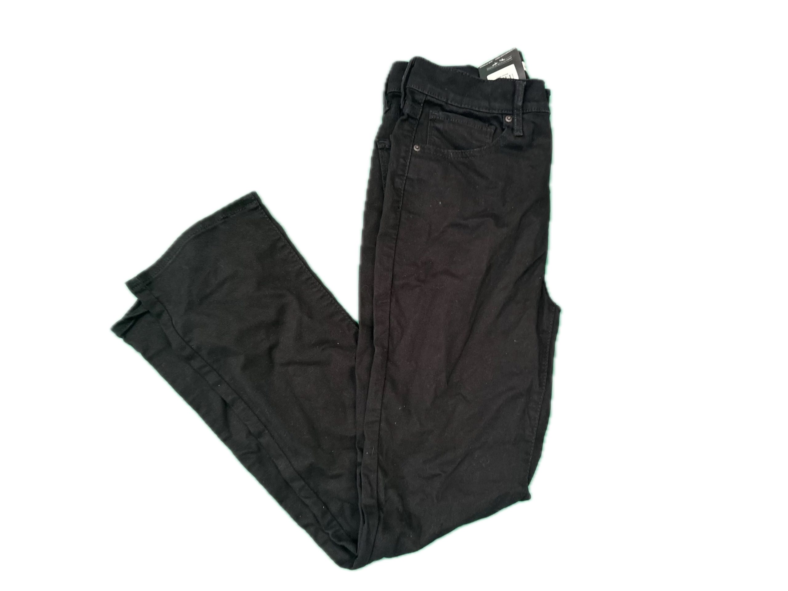 Folded black Levi’s jeans laid flat showing front view